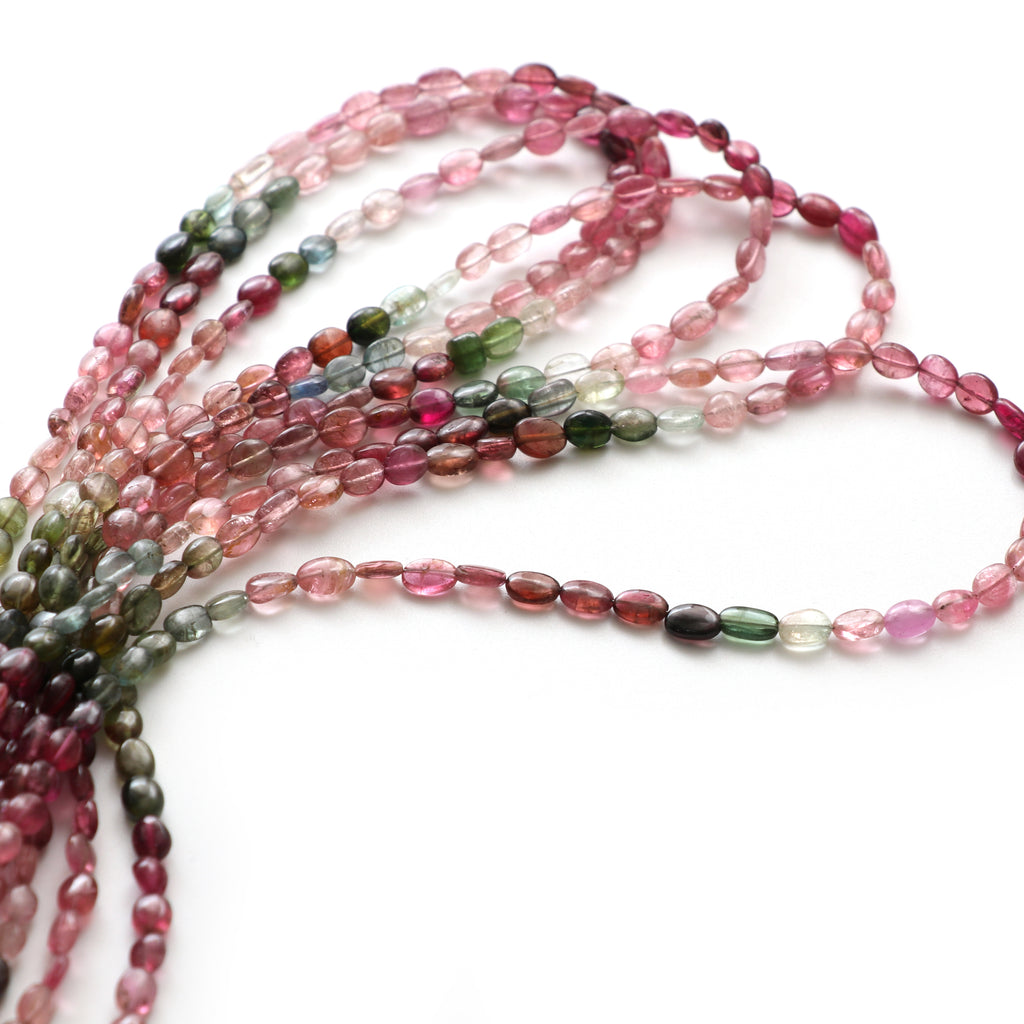 Multi Tourmaline Smooth Tumble Beads, 4x5 mm to 5x6.5 mm, Tourmaline Tumble Jewelry Making Beads, 18 Inch Full Strand, Price Per Strand - National Facets, Gemstone Manufacturer, Natural Gemstones, Gemstone Beads, Gemstone Carvings