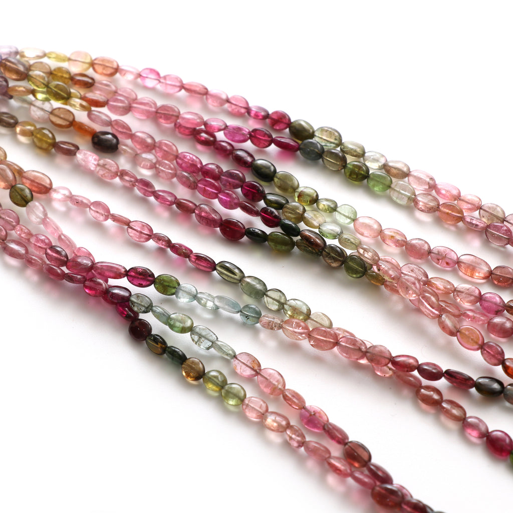 Multi Tourmaline Smooth Tumble Beads, 4x5 mm to 5x6.5 mm, Tourmaline Tumble Jewelry Making Beads, 18 Inch Full Strand, Price Per Strand - National Facets, Gemstone Manufacturer, Natural Gemstones, Gemstone Beads, Gemstone Carvings